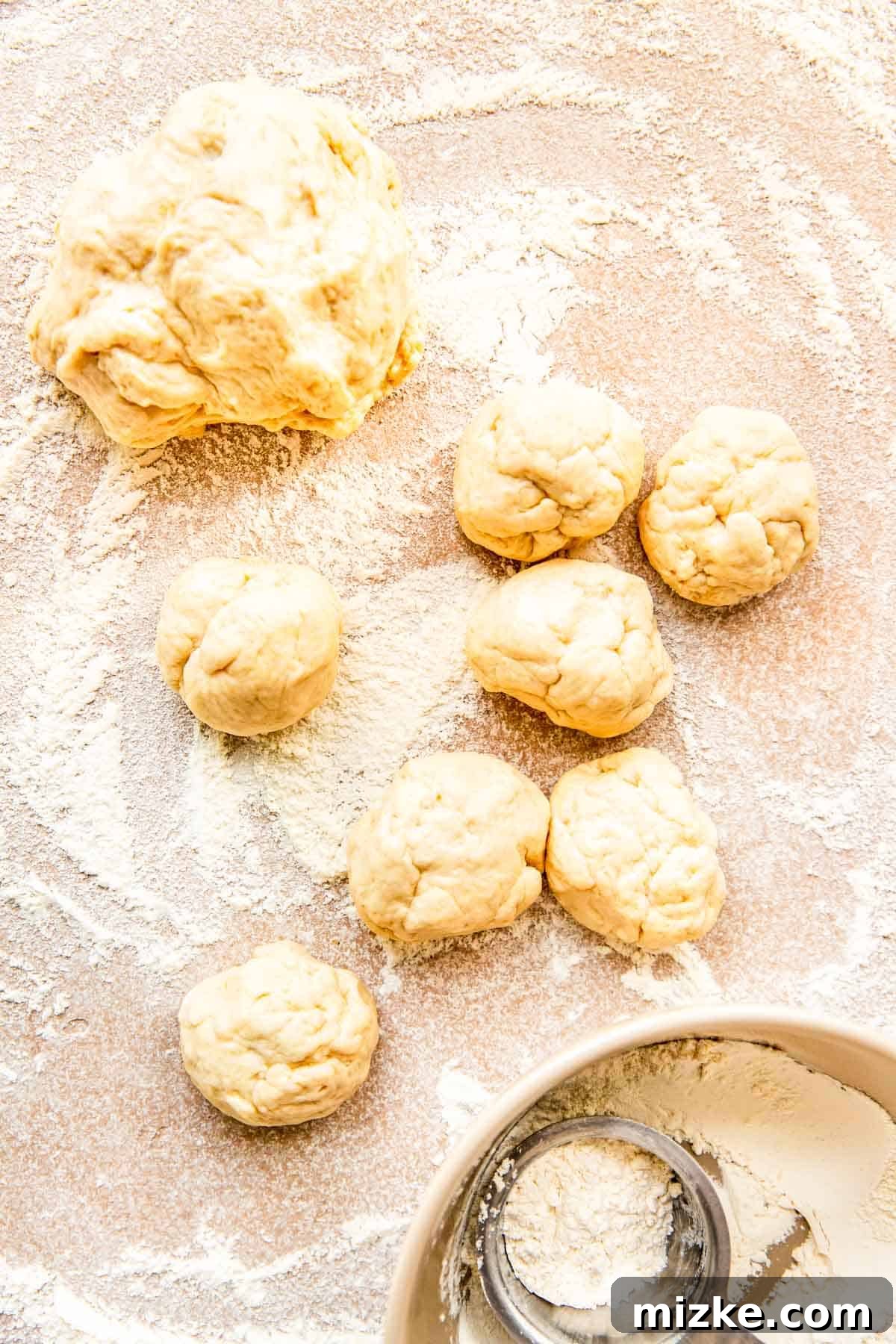 Craft Your Own Perfect Flour Tortillas 5 Multiple small, flattened balls of flour tortilla dough neatly arranged on a lightly floured surface.