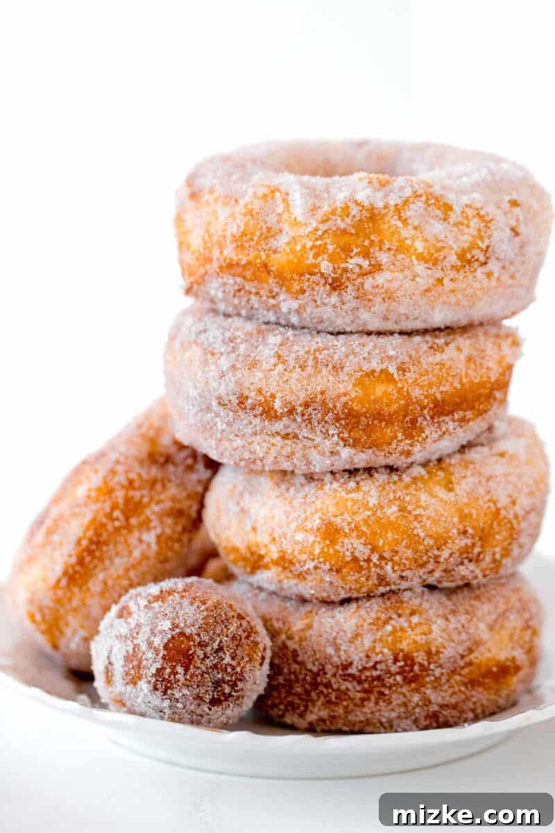 Effortless Biscuit Donut Bliss 2 a stack of 4 biscuit donuts with a donut hole in front