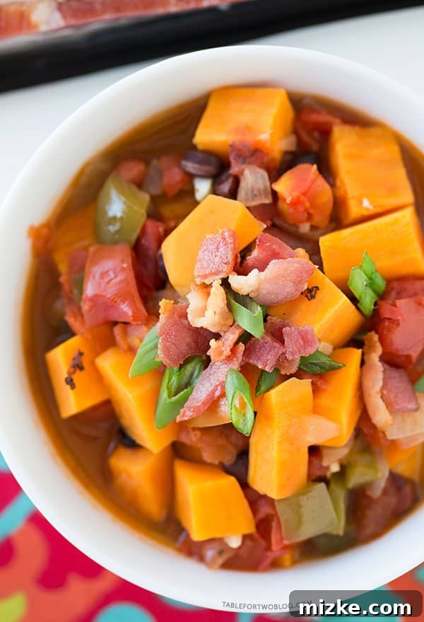 Savory Sweet Potato, Black Bean, and Bacon Chili Delicious Sweet Potato, Black Bean, and Bacon Chili garnished with fresh herbs.