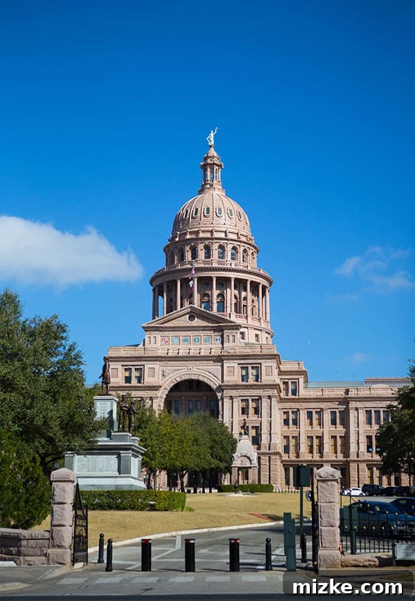 Architectural Splendor: Capitol Dome A detailed view of the Texas State Capitol dome against a clear sky.
