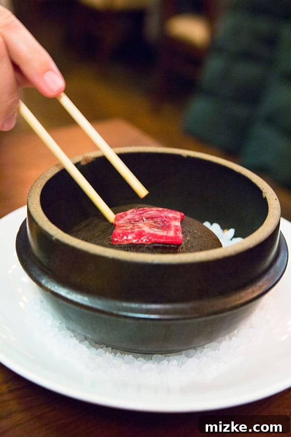 Sear-Your-Own Wagyu Beef Experience at Uchiko Diners preparing to sear their own wagyu beef on a hot Japanese river rock at Uchiko.