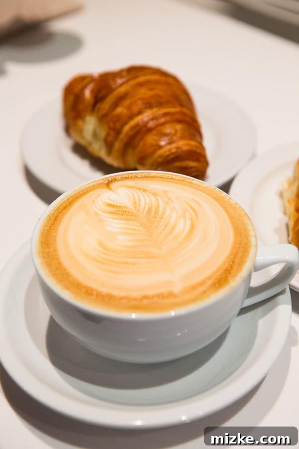 Perfect Latte Art at Caffé Medici A beautifully presented latte with intricate latte art from Caffé Medici.