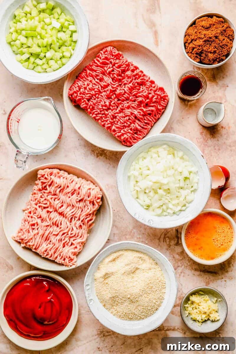 Gather your ingredients for this easy classic meatloaf: fresh ground beef, vegetables, and a few pantry staples for the best weeknight comfort food! A colorful array of fresh ingredients laid out on a wooden cutting board, ready for making classic meatloaf.