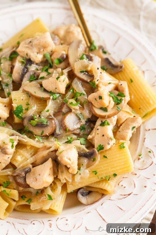 Creamy Marsala Chicken Rigatoni with Mushrooms 5 A wider shot of the finished chicken rigatoni and mushroom marsala in a large skillet, ready to be served, highlighting the generous portion and inviting texture.