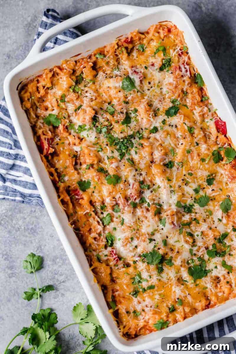 Fiesta Chicken Rice Bake 6 Hearty Tex-Mex Chicken and Rice Casserole with melted cheese, ready for serving.