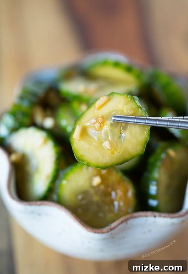 Umami Garlic Cucumbers 3 Close-up of freshly sliced chilled garlic soy cucumbers, glistening with marinade
