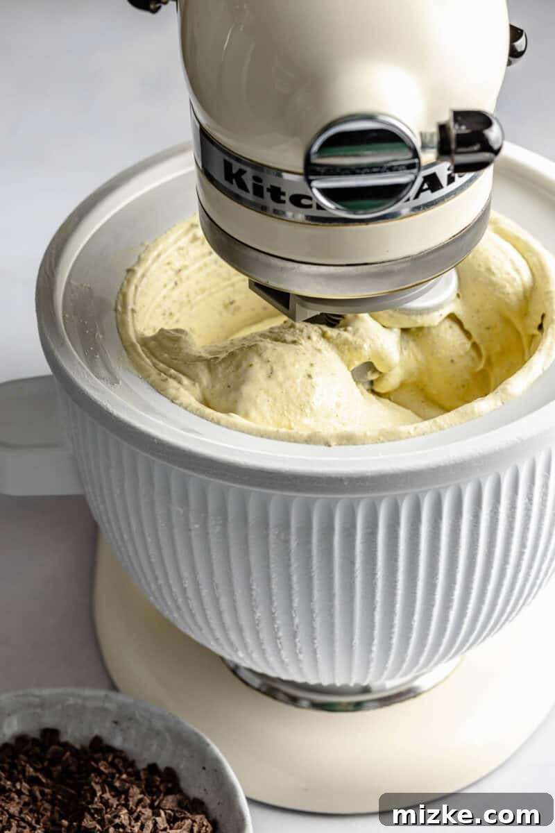 Velvet Pistachio Dream 7 Pistachio ice cream churning in an ice cream maker.