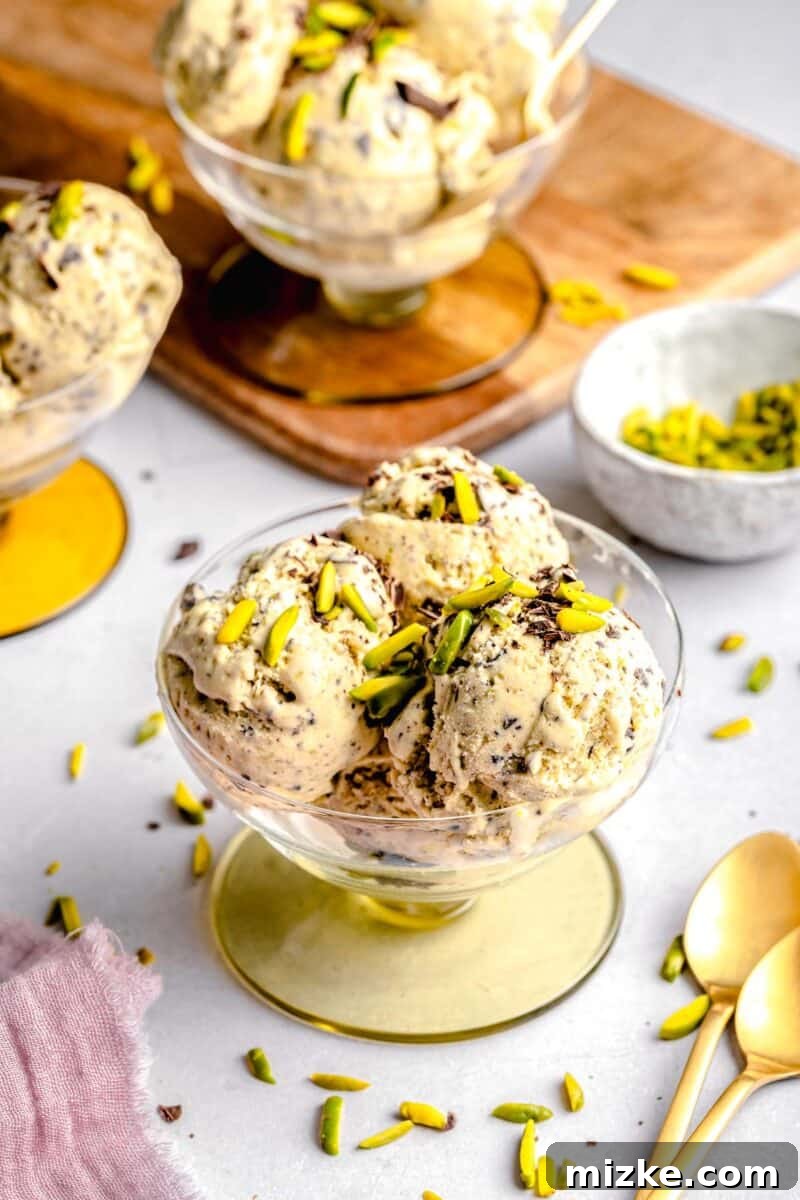 Velvet Pistachio Dream 9 Two bowls of pistachio ice cream, garnished and ready to be served.