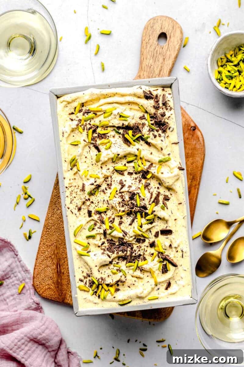 Velvet Pistachio Dream 10 Overhead image of pistachio ice cream in a loaf pan, garnished with pistachios.