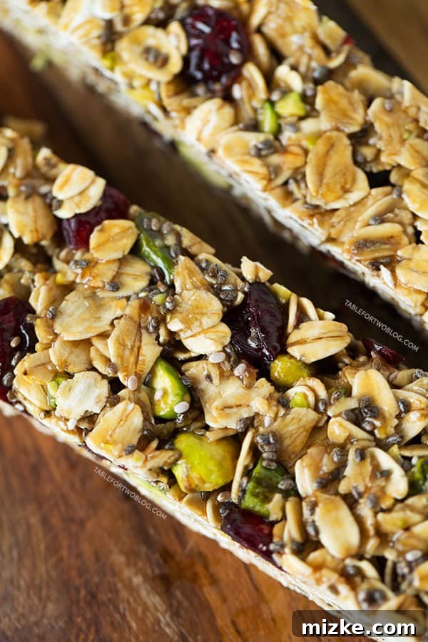 Wholesome Cranberry Pistachio Energy Bars 3 Delicious and healthy Cranberry Pistachio Granola Bars arranged beautifully.