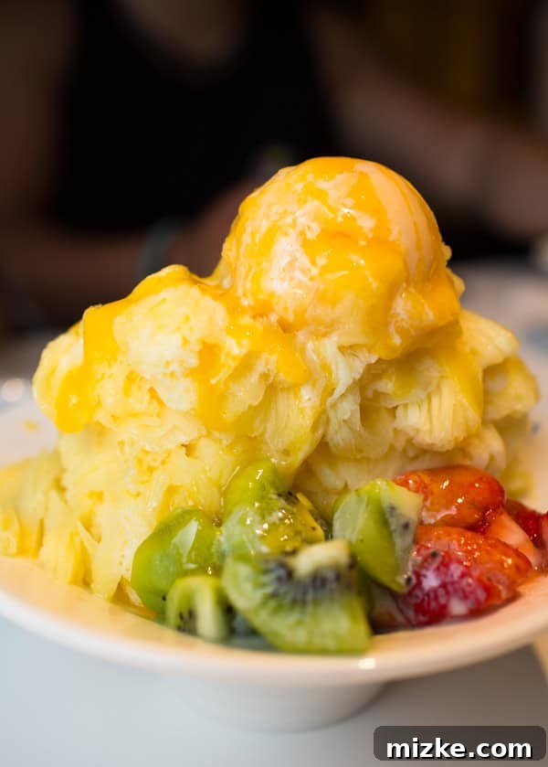 Refreshing mango shaved ice dessert with fresh fruit in Taipei