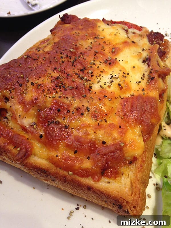 Gooey French bread pizza with melted cheese at Coffee Alley
