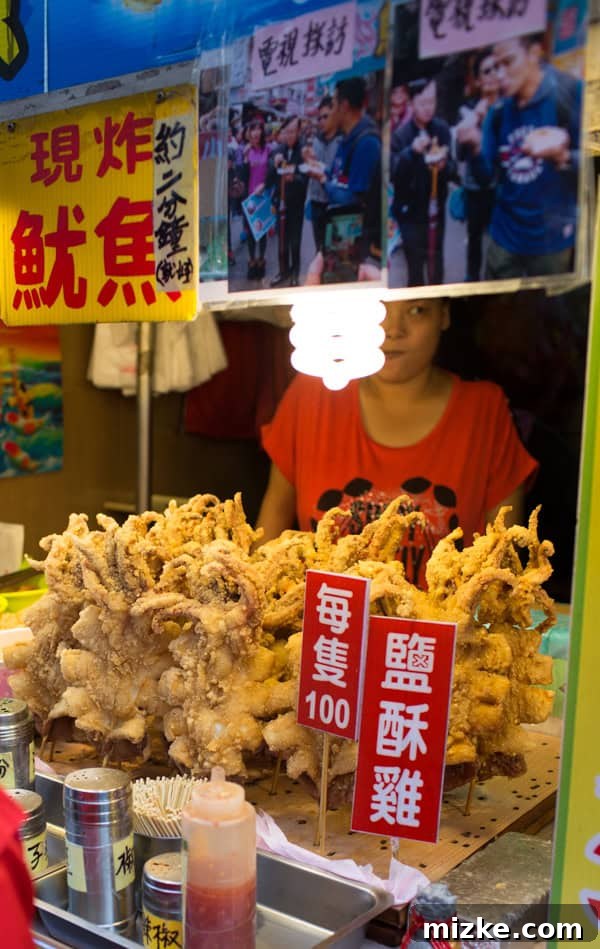 Large fried squid on a stick, a popular street food in Taiwan