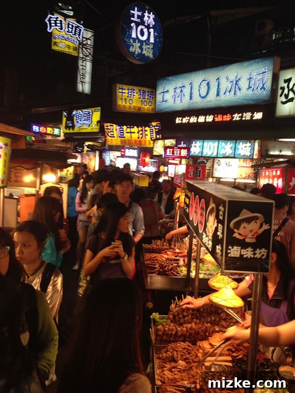 Exploring Taipei's Night Markets and Street Food Sampling Oyster Vermicelli at a Taipei Night Market
