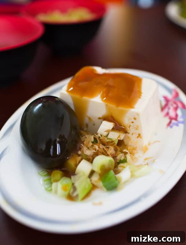 Kaohsiung: Taiwan's Vibrant Southern Hub 14 A bowl of refreshing Pidan Tofu (century egg with silken tofu) served as a cool side dish in Taiwan