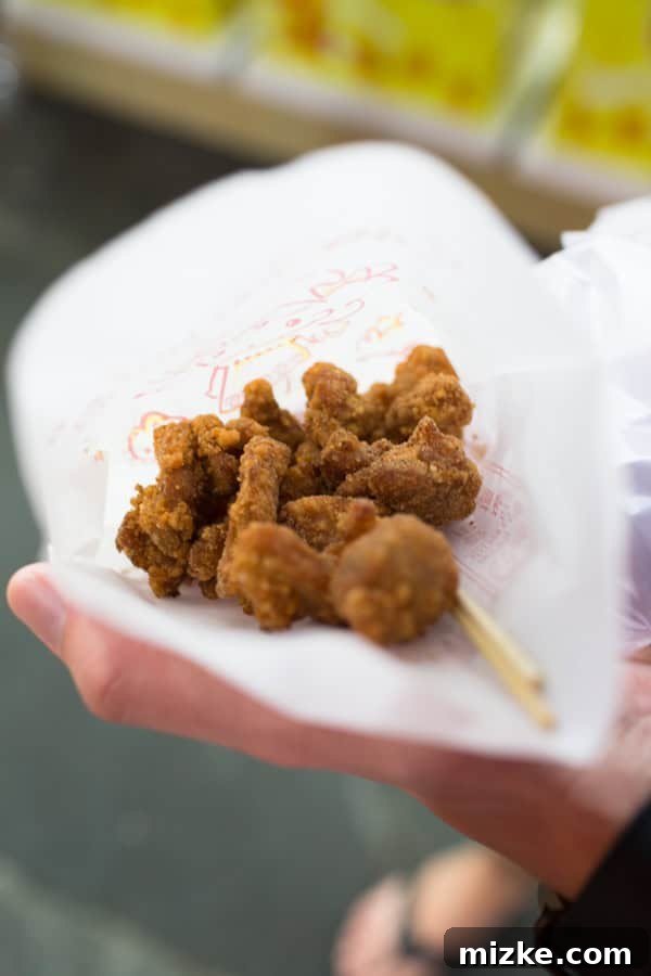 Kaohsiung: Taiwan's Vibrant Southern Hub 27 Delicious Taiwanese salt and pepper chicken (Yan Su Ji) served in a bag at a night market stall