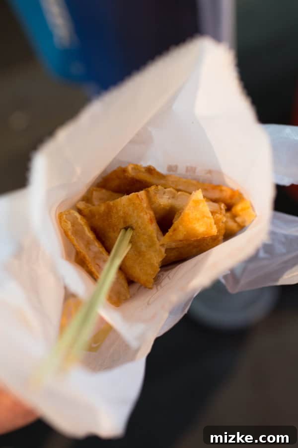 Kaohsiung: Taiwan's Vibrant Southern Hub 28 Crispy fried shrimp cakes, a popular street food snack at a bustling Taiwanese night market