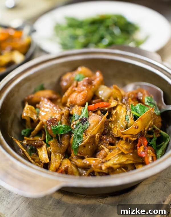 Kaohsiung: Taiwan's Vibrant Southern Hub 4 Authentic Taiwanese Three Cup Chicken (San Bei Ji) served in a traditional clay pot, rich in flavor