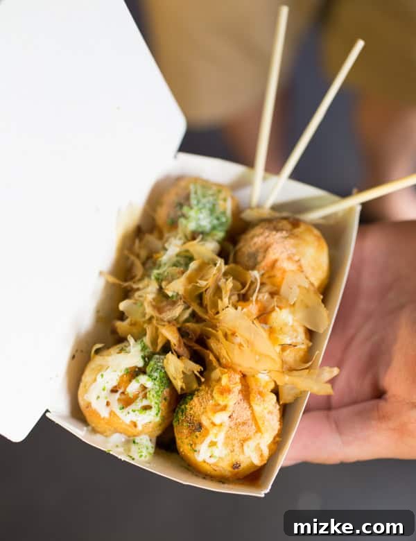 Kaohsiung: Taiwan's Vibrant Southern Hub 31 Savory Taiwanese pancake balls, possibly with cuttlefish filling, from a night market vendor stall