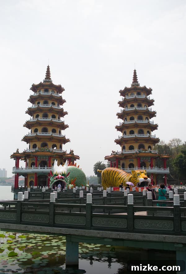 Kaohsiung: Taiwan's Vibrant Southern Hub 5 Visitors entering the Dragon's mouth at Dragon and Tiger Pagodas, Lotus Lake, Kaohsiung, a symbolic entrance