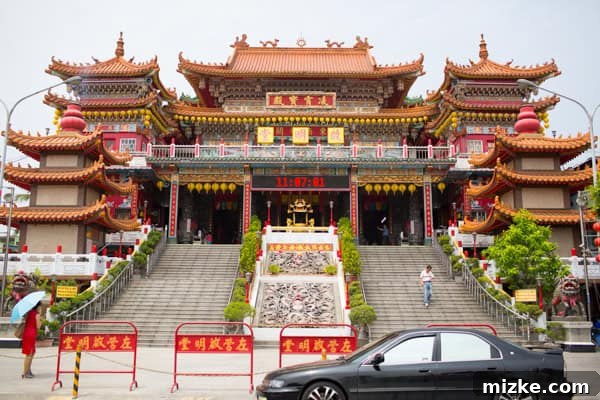 Kaohsiung: Taiwan's Vibrant Southern Hub 10 A serene walkway leading to a temple, adorned with traditional lanterns and elegant decor in Kaohsiung