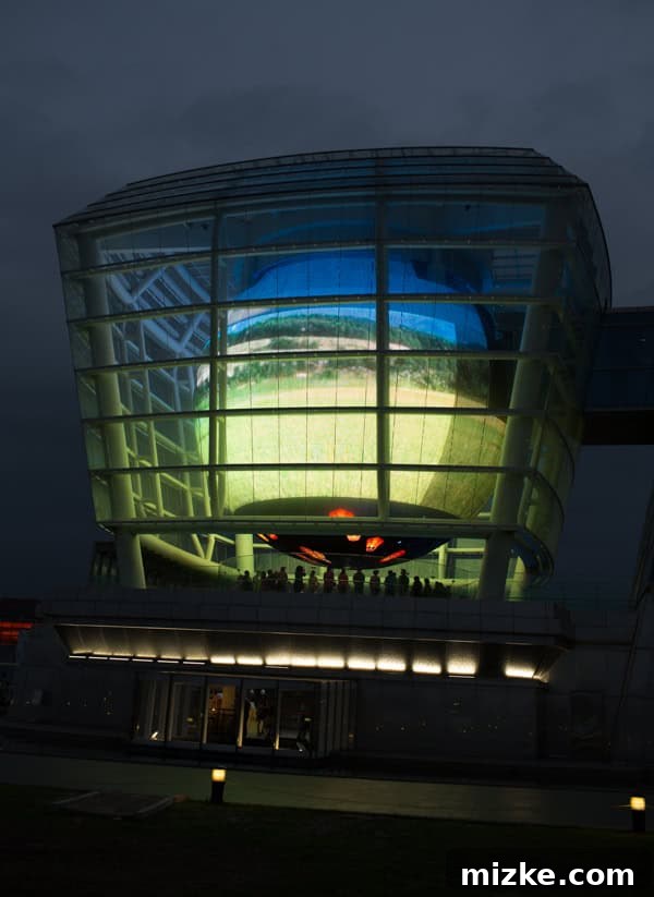Hsinchu: Taiwan's Innovation Nexus 5 The exterior of the Taiwan Pavilion at night, showcasing its unique lantern-like glass structure.