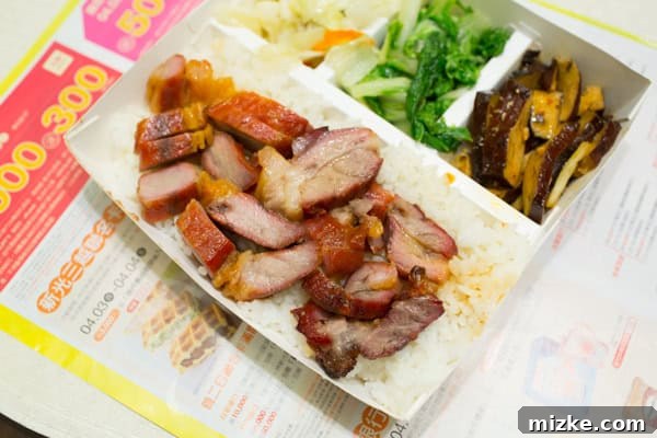 Hsinchu: Taiwan's Innovation Nexus 6 A delicious and diverse Taiwanese take-out box, featuring a variety of local dishes.