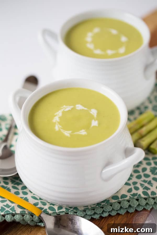 Velvety Chilled Asparagus Soup 2 A serene view of the beach after the hurricane, with clear skies and calm waters, featuring a vibrant green umbrella.