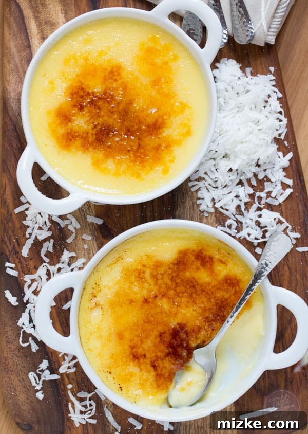 Paradise Coconut Creme Brulee 6 A close-up of the perfectly golden and crunchy caramelized sugar crust on a Coconut Crème Brûlée, ready for serving.
