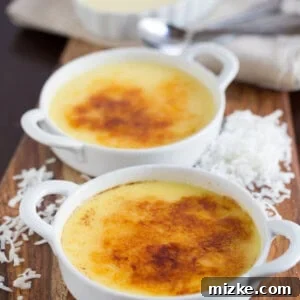 A beautifully set Coconut Crème Brûlée with a perfect golden crust, garnished for serving.