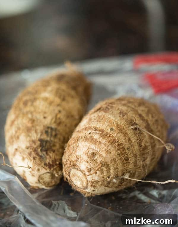 A basket full of golden homemade taro chips, ready to be enjoyed as a satisfying snack.