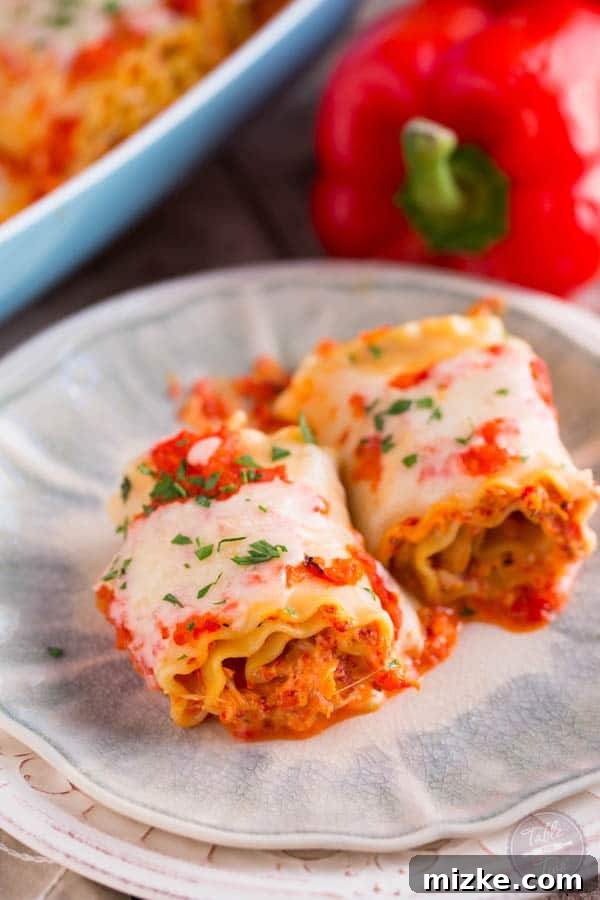 Gourmet Chicken and Roasted Red Pepper Lasagna Pinwheels 4 Ingredients for Roasted Red Pepper Chicken Lasagna Rolls laid out, including cooked lasagna sheets, peppers, and cheese.