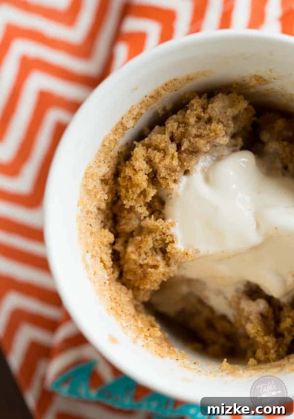 Another beautiful shot of the pumpkin spice mug cake, emphasizing its inviting texture and golden-brown hue.