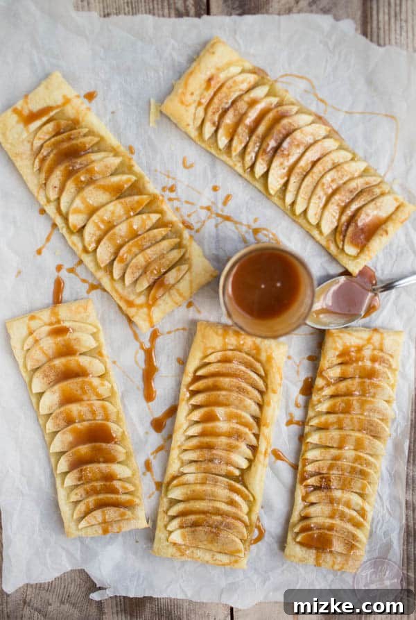 Sea Salt Caramel Apple Tarts 3 Close-up of a salted caramel apple tart, golden brown and drizzled with sauce, ideal for a relaxing personal day.