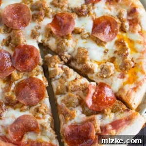 Spicy sausage and pepperoni pizza is so much better made at home than getting delivery! You'll thank me later.