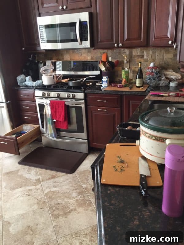 A busy kitchen counter with cooking in progress and dishes, representing the reality of daily cooking.