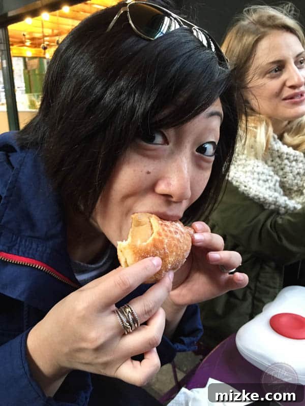 Savoring Market Life Market-goer enjoying a hot drink amidst the bustling atmosphere
