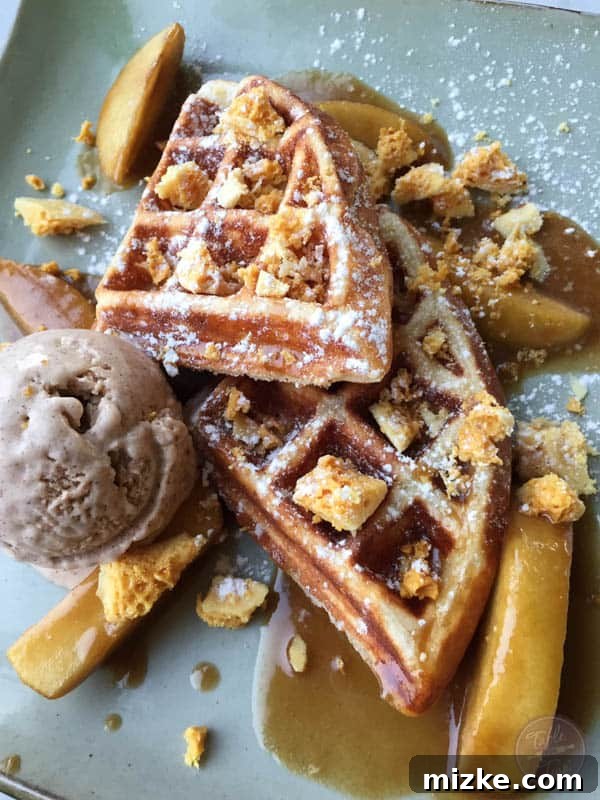 Decadent Apple Toffee Waffles A close-up of the apple toffee waffles with cinnamon ice cream