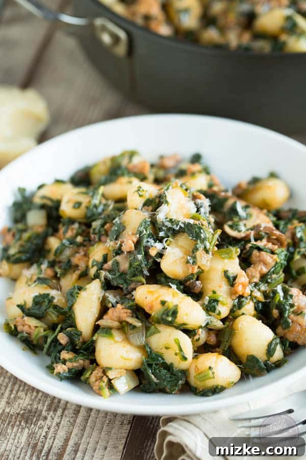 Rustic Spicy Sausage Gnocchi with Spinach and Mushrooms 4 A close-up view of the raw ingredients for spicy sausage, spinach, and mushroom gnocchi laid out, including uncooked gnocchi, fresh mushrooms, and vibrant spinach, emphasizing the simplicity and freshness of the components.