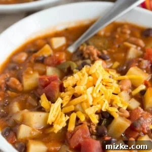 Hearty Chorizo Potato and Double Bean Crockpot Chili 6 A comforting bowl of spicy chorizo, potato, and two-bean chili, ready to serve.