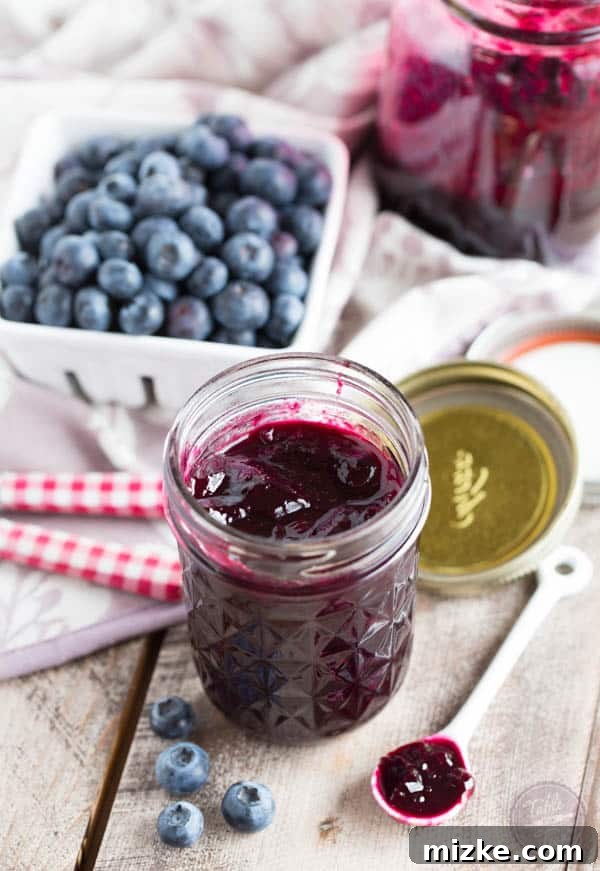 Indigo Bloom Jam 2 Vibrant homemade blueberry lavender jam in a mason jar, ready to be enjoyed with breakfast.