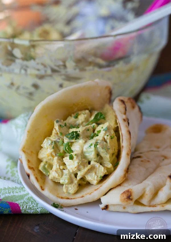 Golden Curry Chicken Salad 5 A generous scoop of curry chicken salad presented beautifully, highlighting its appealing texture and rich, golden color.
