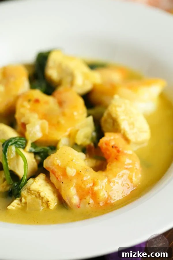 Tropical Garlic Coconut Curry Shrimp and Chicken Bowl 3 This garlic coconut curry shrimp bowl is bursting with rich flavor and paleo-friendly! You'll love the crispy exterior of the shrimp in the creamy and hearty soup!