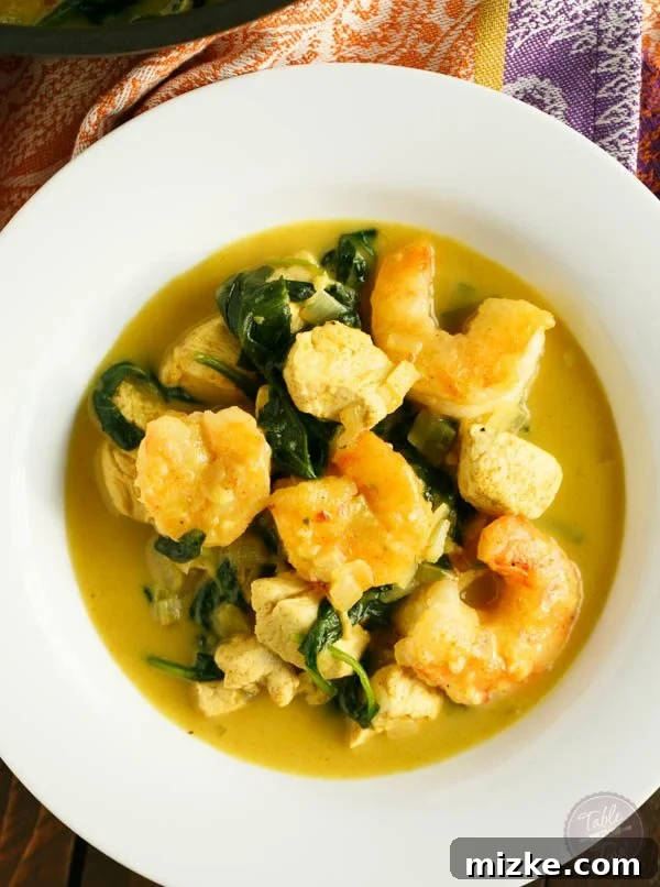 Tropical Garlic Coconut Curry Shrimp and Chicken Bowl 4 This garlic coconut curry shrimp bowl is bursting with rich flavor and paleo-friendly! You'll love the crispy exterior of the shrimp in the creamy and hearty soup!