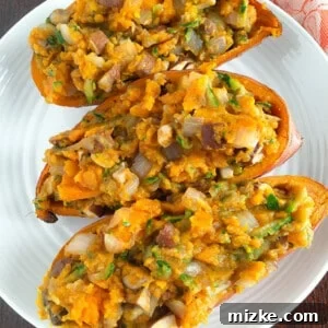 A delicious and healthy loaded sweet potato recipe with shredded zucchini, mushrooms, and onions.