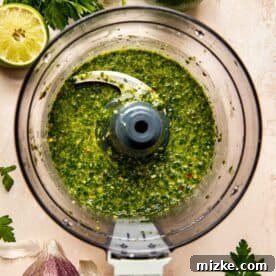 chimichurri sauce blended in the bowl of a food processor