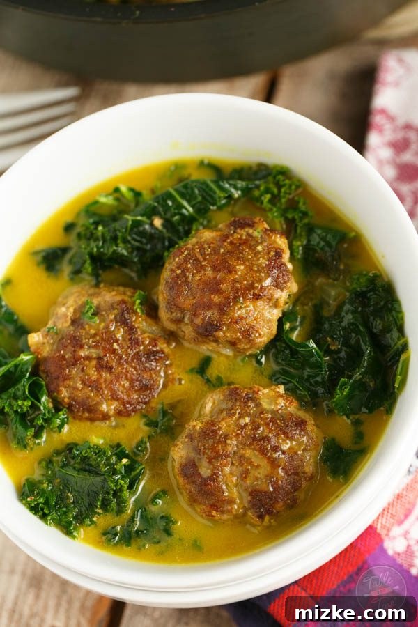 Aromatic Meatball and Kale Curry 2 A deliciously comforting and vibrant bowl of curry meatball and kale stew, perfect for any night of the week and paleo-friendly.