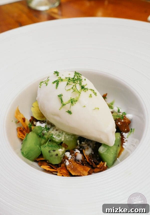 Exquisite coconut milk ice cream dessert with kiwi and caramel.