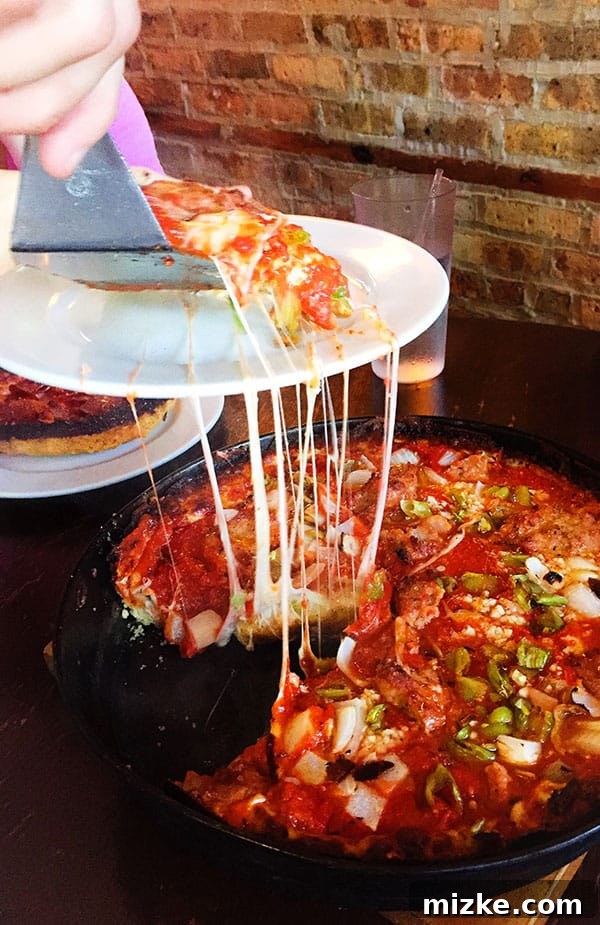 Chicago Dining Uncovered 17 Close-up of Pequod's deep dish pizza with caramelized crust, a Chicago classic