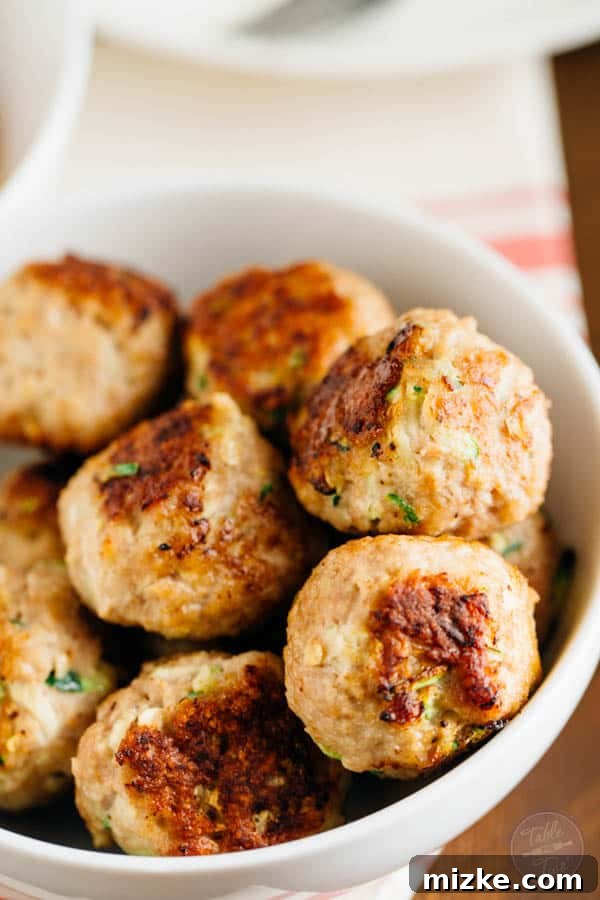 Homemade zucchini turkey meatballs with zoodles, a perfect healthy and quick dinner idea.